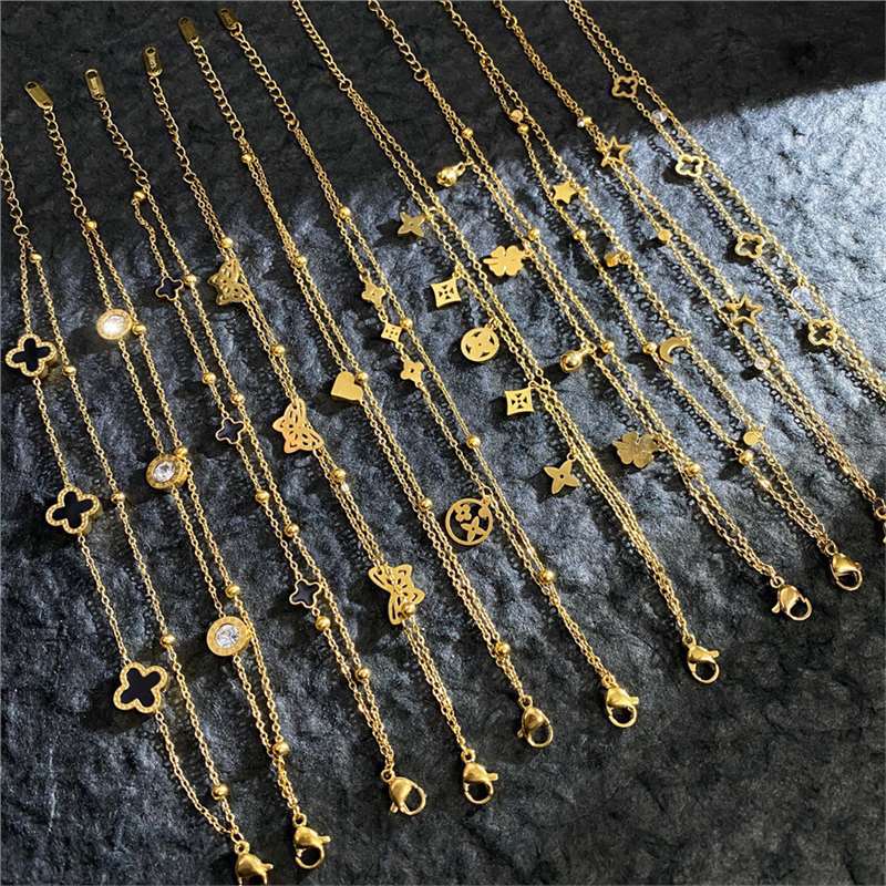 full-body titanium steel vacuum plated golden four-leaf clover roman numeral double-layer bracelet titanium steel plated real gold factory price