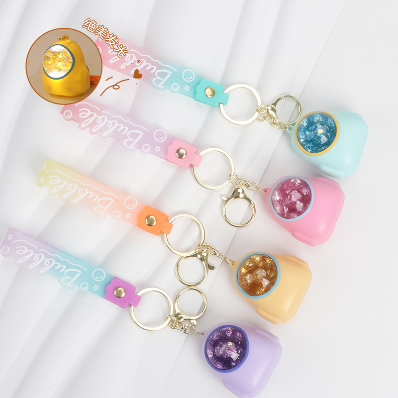 Oil flowing sand bottle colored beads floating liquid fluid luminous keychain luminous backpack floating colored beads keychain