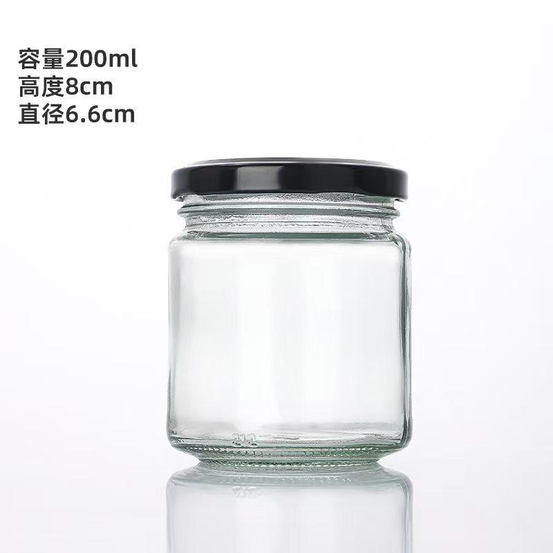 Botella de vidrio al por mayor botella vacía de grado alimenticio hervir botella de conservación de miel mermelada botella de hongos shiitake