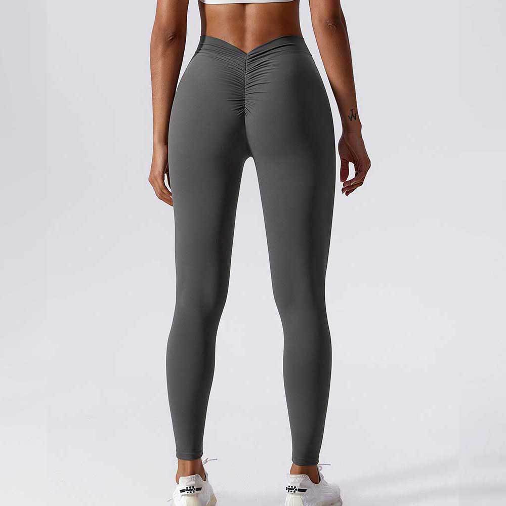 Nuevos productos personalizados de color sólido de la cintura trasera en V arrugada de caderas desnudas de nueve pantalones de alta elasticidad de pantalones de acondicionamiento físico para mujeres