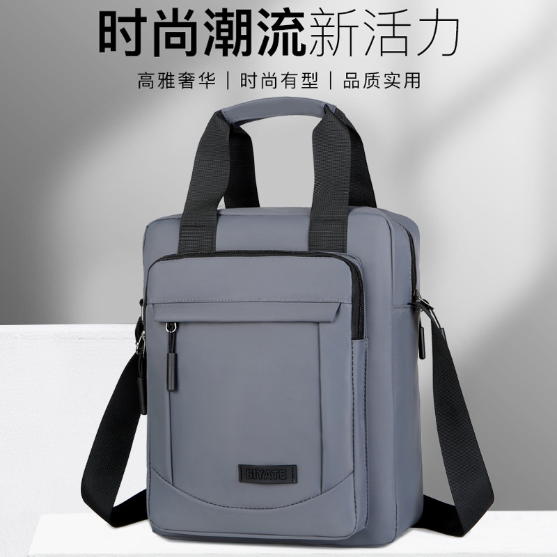 新款时尚男士手提包商务休闲单肩包防水布斜挎包商务平板公文包男