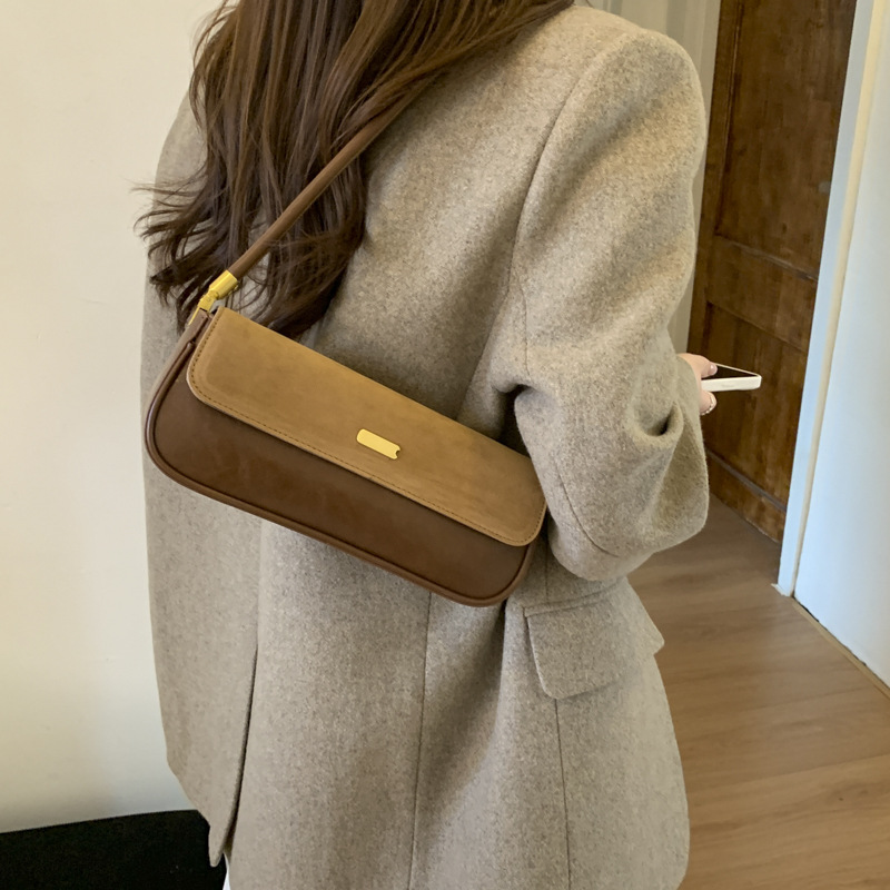 Bolsas de brazo retro de moda transfronteriza mujeres 2025 invierno nuevo estilo francés nicho bolsas de palo de moda bolsas de hombro casuales
