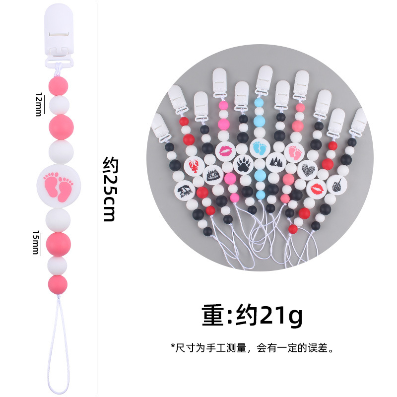 Nuevo bebé suministros de dibujos animados de impresión redonda amor creativo DIY silicona mordedura molar pezón cadena anti-caída