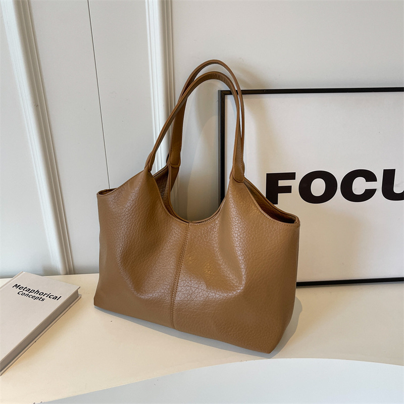 Bolsa de cuero suave transfronteriza para mujeres de gran capacidad 2025 nueva bolsa de hombro simple de textura casual