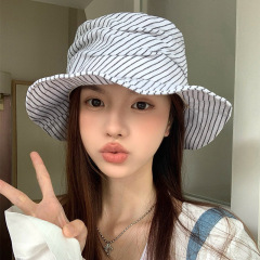 韓国版の大衆デザインの綿麻のしわのストライプの平頂の漁師の帽子のカジュアルな百合の日よけの帽子の小さい清新な盆の帽子