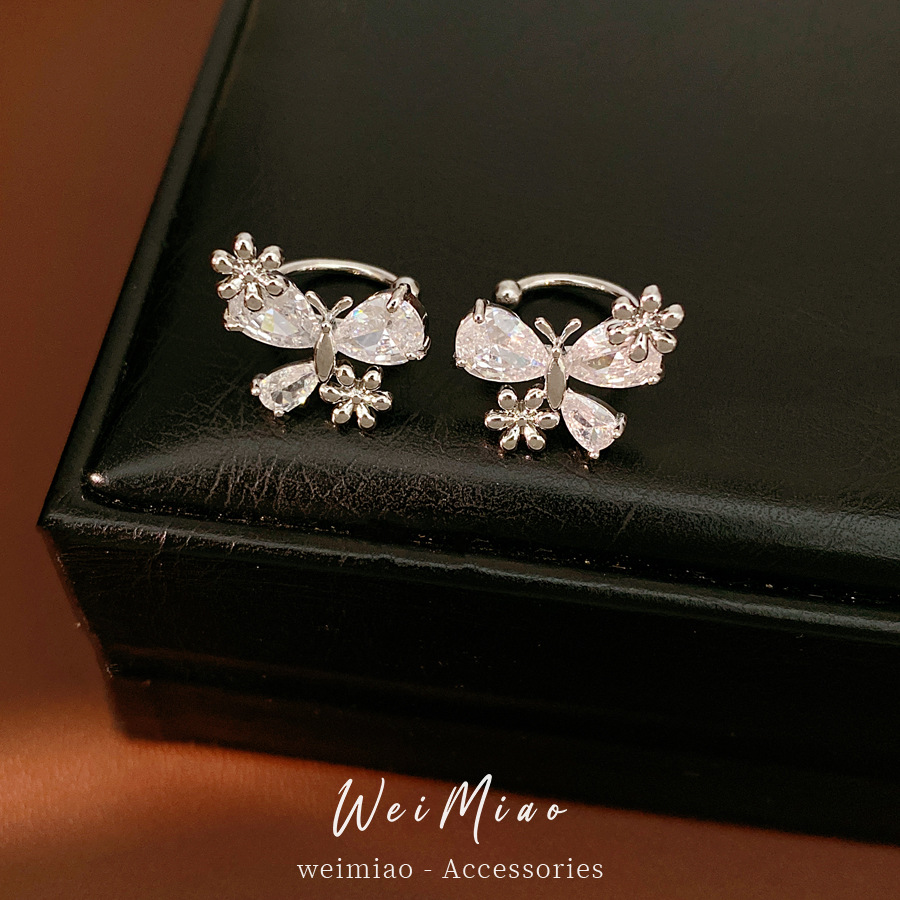 Zircon arco flores orejas clips de orejas mujeres sin agujeros de orejas personalidad temperamento nicho pendientes ligero lujo alta sensación auriculares al por mayor
