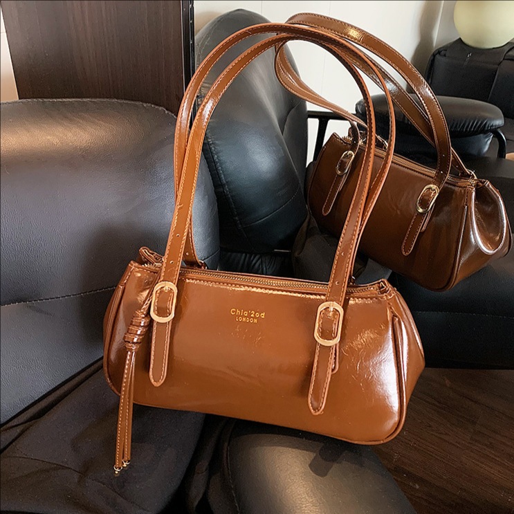 Bolsa de almohada portátil retro transfronteriza para mujeres otoño / invierno 2025 nuevo tipo de alta calidad de viaje a la axila bolso de hombro universal