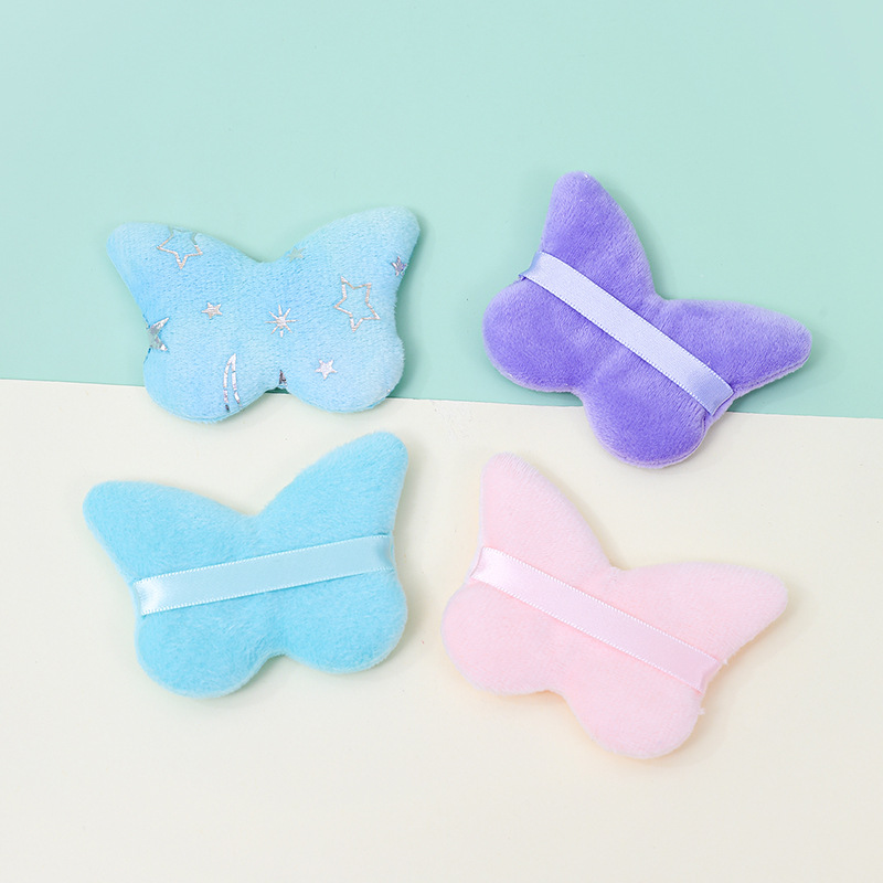 La borla de flocado corto en forma de mariposa transfronteriza no come polvo esponja de terciopelo de pie polvo suelto maquillaje maquillaje maquillaje algodón fábrica personalizado al por mayor