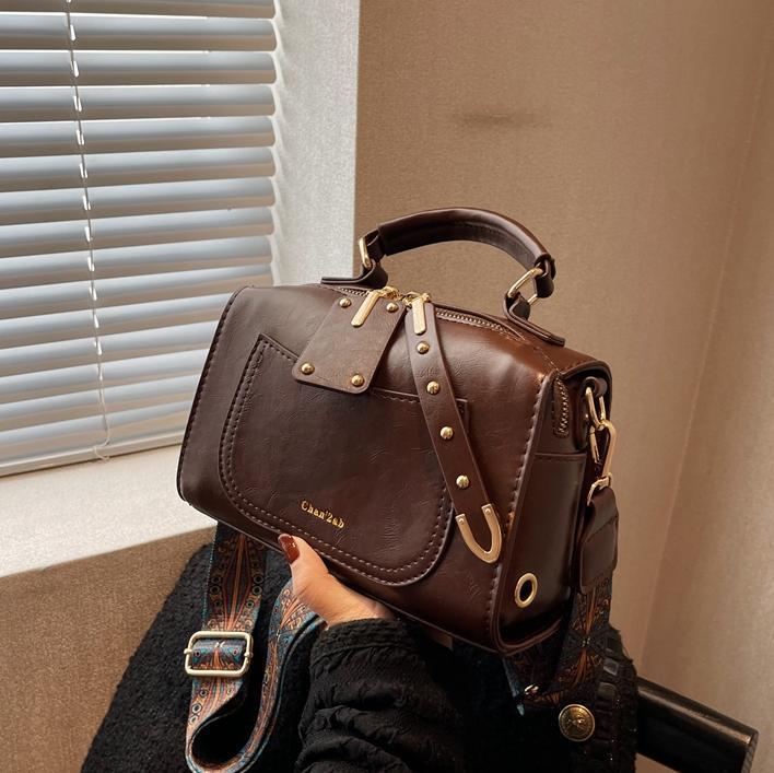 Bolso de viajero retro transfronterizo para mujer 2025 nuevo bolso de Boston casual simple moda bolso de mensajero portátil de todo fósforo