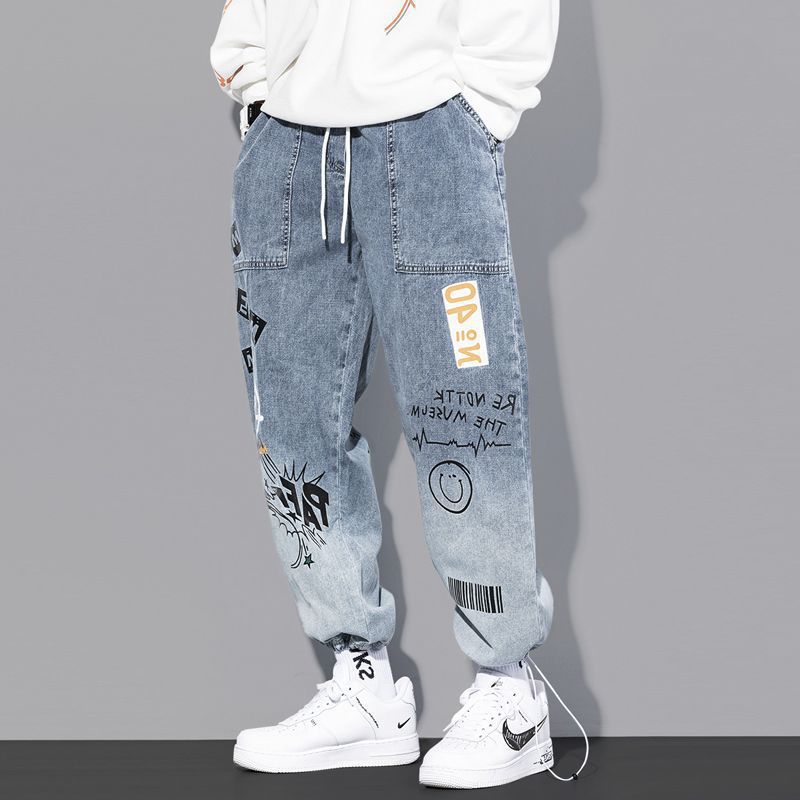 Jeans marca de moda para hombres rap hip hop Pantalones rectos de pierna ancha graffiti dibujos animados gradiente de moda suelta pantalones harén atados al tobillo