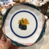 6.25-inch flower-shaped dish—small yellow flowers
