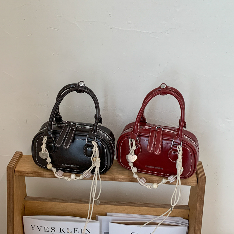 Bolsa de hombro coreana de diseño de nicho simple 2026 nueva moda femenina de tendencia diaria textura de viaje popular bolso de hombro