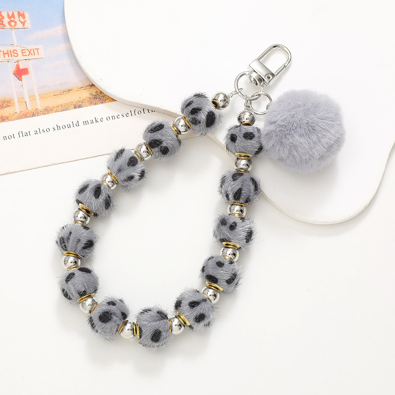 Nuevo Otoño e Invierno de moda ins Bola de piel teléfono móvil colgante teléfono Shell colorido con cuentas de felpa correa de muñeca conveniente correa de mano