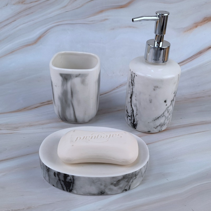 Taza de enjuague bucal de mármol Juego de baño Botella de prensa de cerámica Juego para el hogar Juego de tres piezas de almacenamiento de baño de hotel