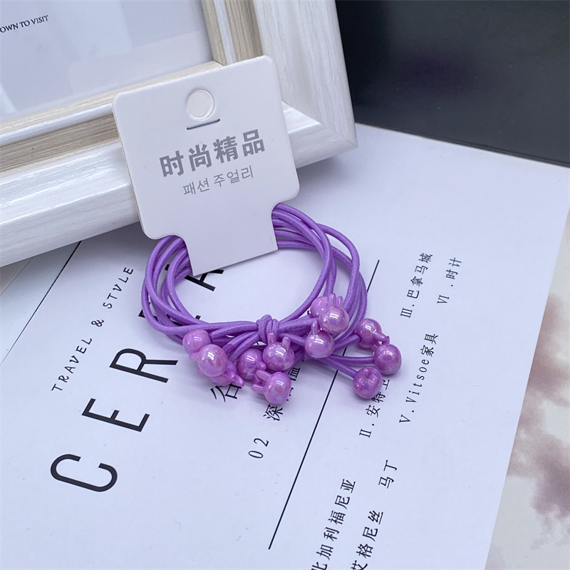 Electroplated AB color caramelo color tres en una tarjeta de dibujos animados banda de pelo banda de goma cuerda de pelo de las mujeres 2 yuanes tienda de accesorios para el cabello