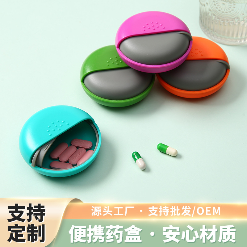 Los fabricantes suministran caja de medicina redonda de una rejilla caja de almacenamiento de plástico Push-Pull caja de medicina caja de embalaje portátil al por mayor