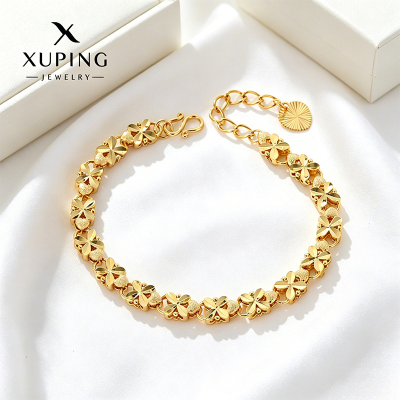 Xuping Europa y los Estados Unidos transfronterizos cuatro hojas de flores amor pulsera de oro de aleación de cobre ligera joyas de lujo al por mayor personalizadas