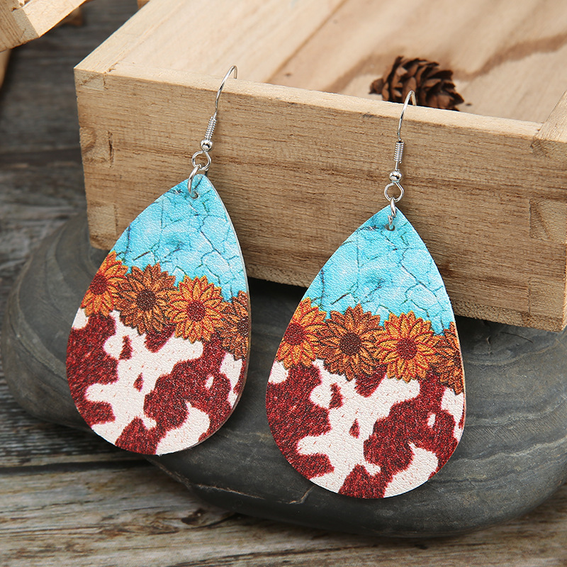 Fashion Turquoise Cow Grain Sunflower Pattern Leather Earrings display picture 1