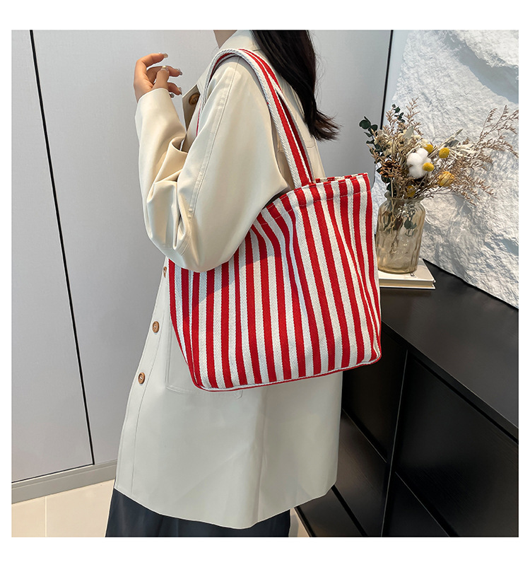 2024 Autumn/Winter new versatile and fashionable striped handbag shopping bag, two-tone large-capacity trendy single-shoulder bag undefined