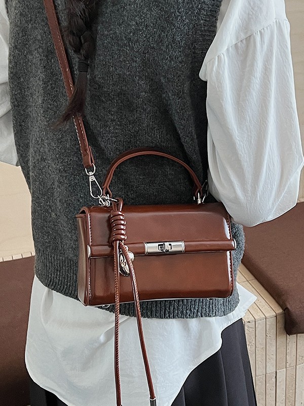 Bolso de mano de alta sensación para mujeres 2026 nuevo bolso cuadrado ligero de textura de lujo estilo coreano nicho bolso de hombro de mujer