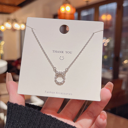 Light Luxury, Niche Zircon Bowknot Titanium Steel Necklace for Women – Versatile, Elegant, Minimalist Design, Trending Online, Same Style as Influencers' Clavicle Chain