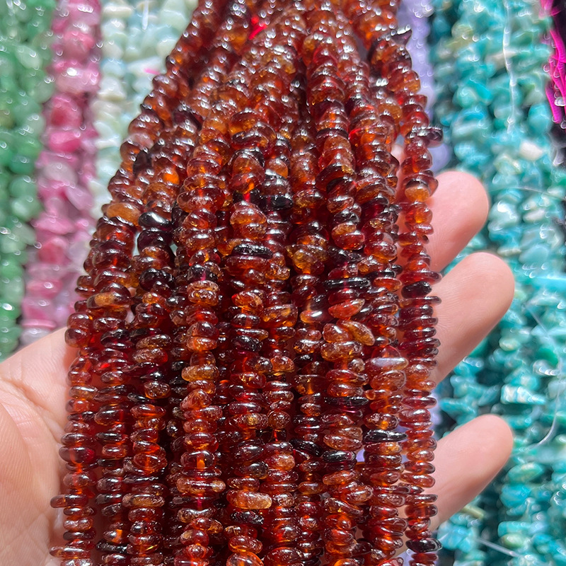 A strand of natural orange garnet, approximately 80cm in length