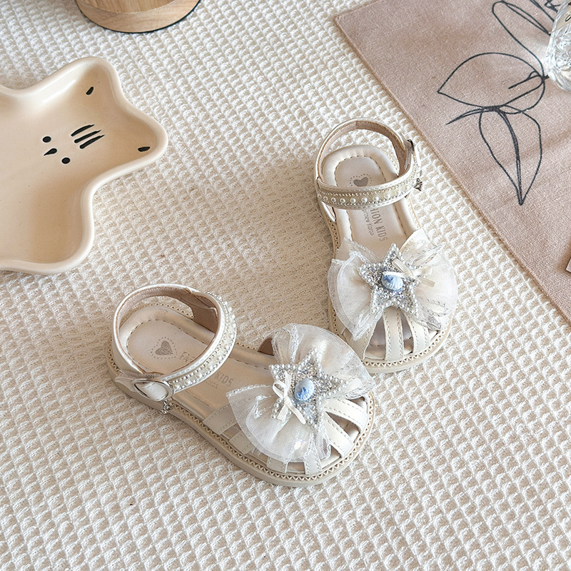 Niñas sandalias Baotou 2026 verano nuevo estilo de moda infantil sandalias versátiles diamante estrella malla princesa zapatos de moda