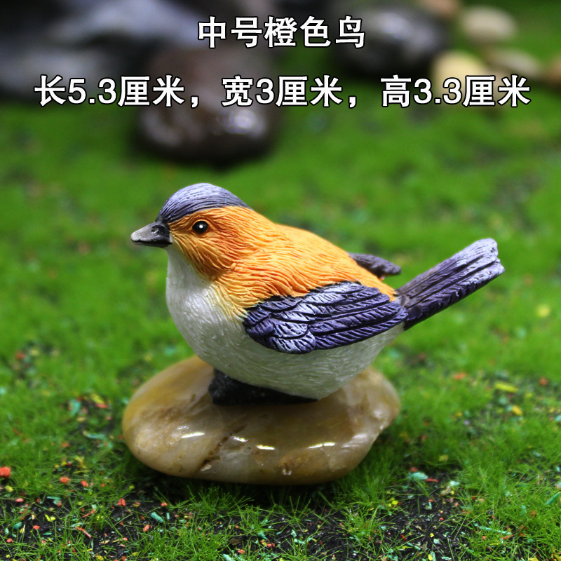 Oiseau orange moyen