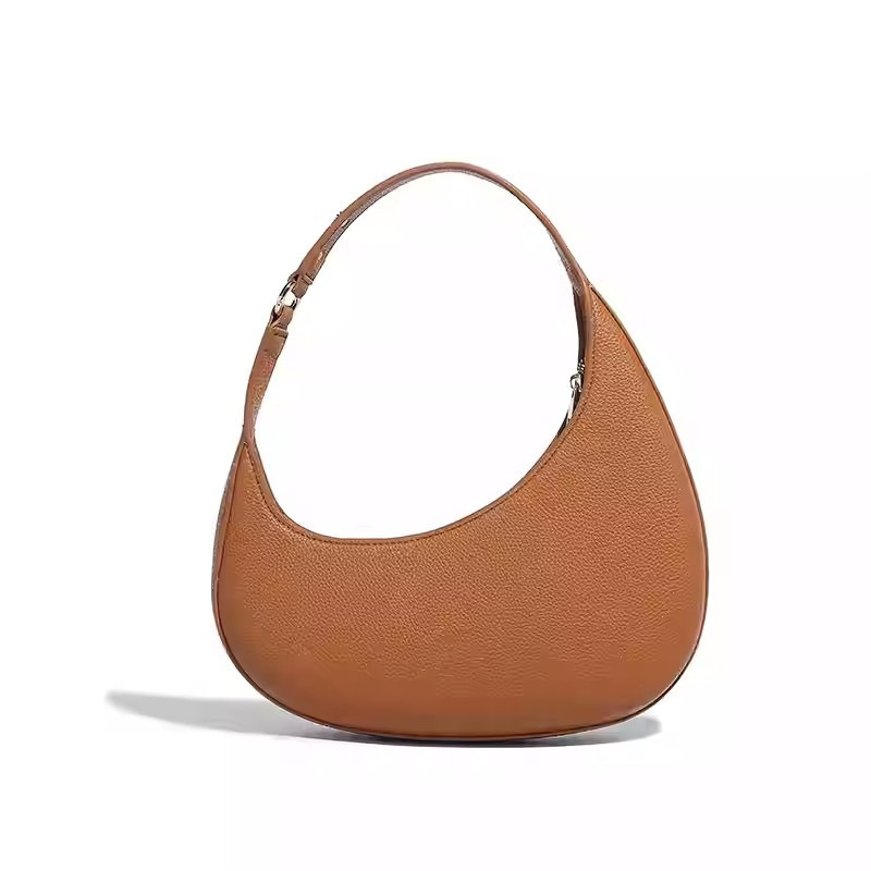 2025 nuevo diseño de nicho de moda europea y americana, bolso de luna creciente irregular en forma de media luna, bolso de axila de alta gama, mujer
