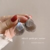 Silver hollow heart-shaped petal tassel earrings