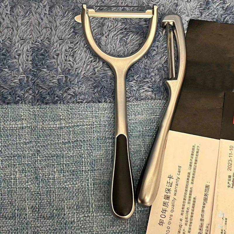 ドイツのステンレスの皮むき刀の台所の家庭用皮むきの神器の果物の野菜の果物はステンレスの皮むき刀を削ります。|undefined