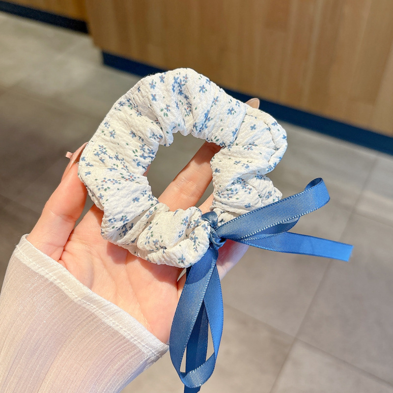 Pastoral viento intestino anillo de cabello mujer 2025 nuevo estilo de alta sensación bola de cabello cuerda de cabeza flor dulce princesa adornos de cabello cuerda