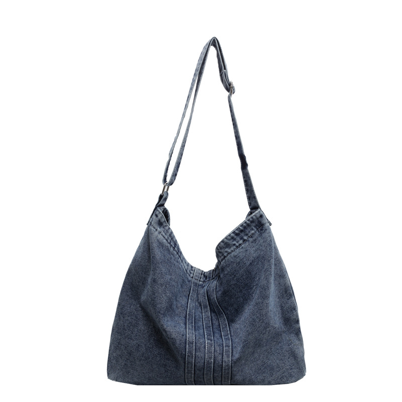 Bolso de mezclilla lavado de viento perezoso para mujer 2025 nuevo bolso de lona literario bolso de hombro de gran capacidad al por mayor