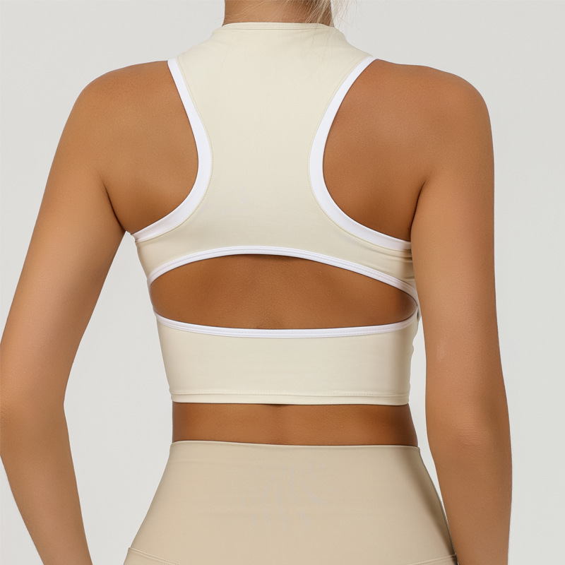 Chaleco de yoga deportivo europeo y americano personalizado para mujer con cremallera envuelta en el pecho a prueba de golpes y contraste de color fitness de secado rápido