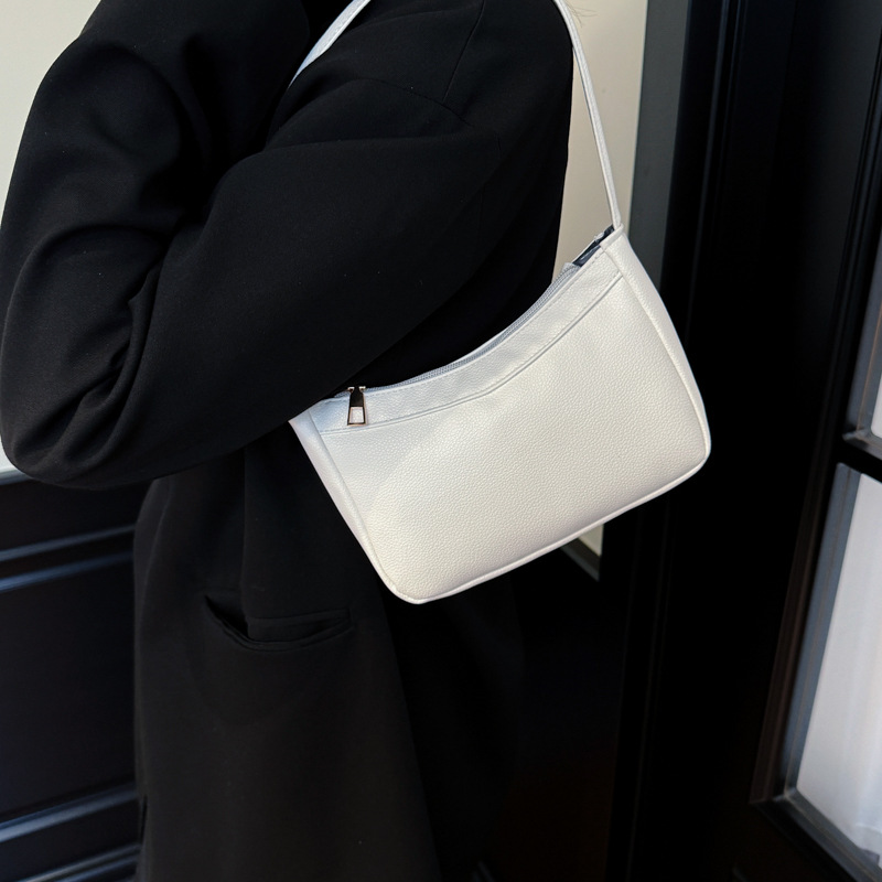 Bolsos de hombro coreanos para niños y niñas, bolsos de moda de color sólido, bolsos portátiles compactos y ligeros, 2026 nuevas bolsas para niños transfronterizas, bolsos de moda
