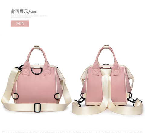 The Mommy bag is small and cute. It has a detachable front pocket and is a multi-functional baby bag. It is waterproof, lightweight, and has a crossbody design. It can be used to carry milk bags undefined
