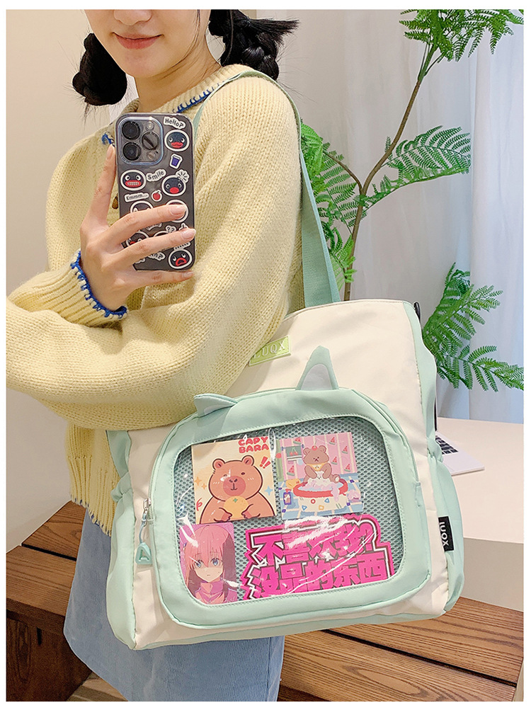 The new cute cartoon printed student bag with a large capacity and transparent student storage single-shoulder bag is selling well for women undefined