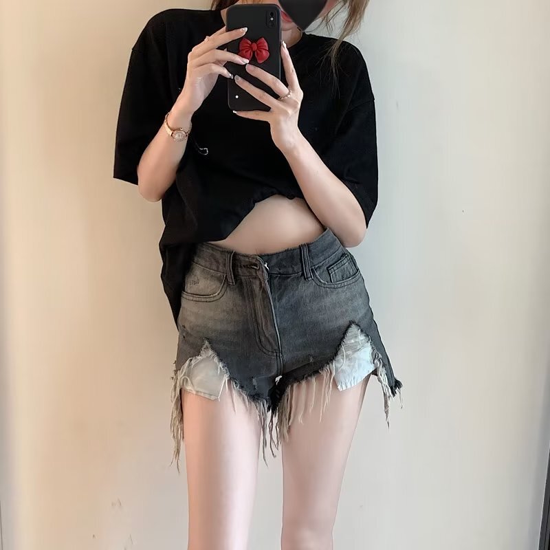 黒灰色の高腰の穴が開いているデニムの半ズボンの女性の夏の新型はゆったりしていて痩せています。|undefined