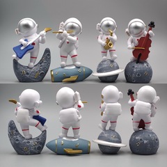 A set of four space bandit astronaut figures, car dashboard desk ornaments, collectible figurines