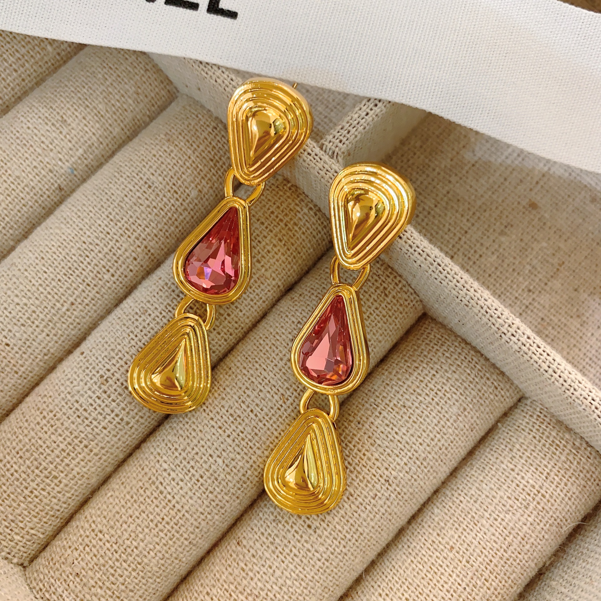 Elegant long golden water drop-shaped