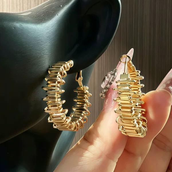 French wave-style, asymmetrical metal earrings for women, featuring a spring-wrapped design, with a retro, high-end, and elegant aesthetic; wholesale available
