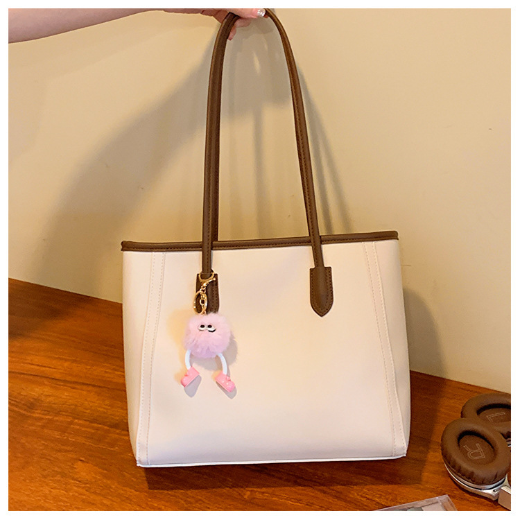 Bolso de mano texturizado estilo commuter para comercio exterior, nuevo bolso versátil estilo coreano para otoño e invierno 2025, bolso elegante tipo tote.