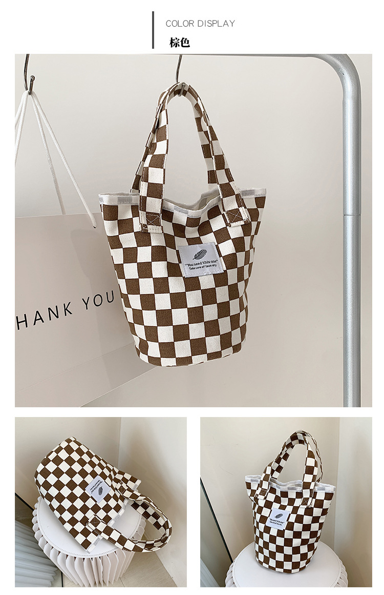 A fashionable new Japanese and Korean chic black and white checkered canvas bag, a large-capacity single-shoulder bag for women, and a simple student handbag undefined