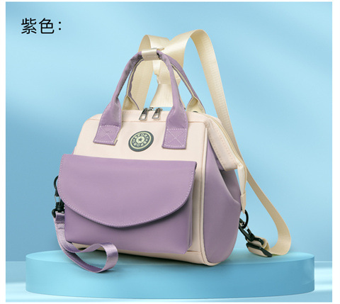 The Mommy bag is small and cute. It has a detachable front pocket and is a multi-functional baby bag. It is waterproof, lightweight, and has a crossbody design. It can be used to carry milk bags undefined
