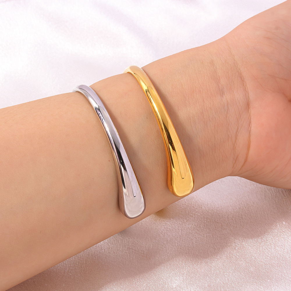 Joyas transfronterizas europeas y americanas exageradas gotas de agua simples acero titanio espejo brillante brazalete abierto de 18 quilates accesorios de mano de viento frío