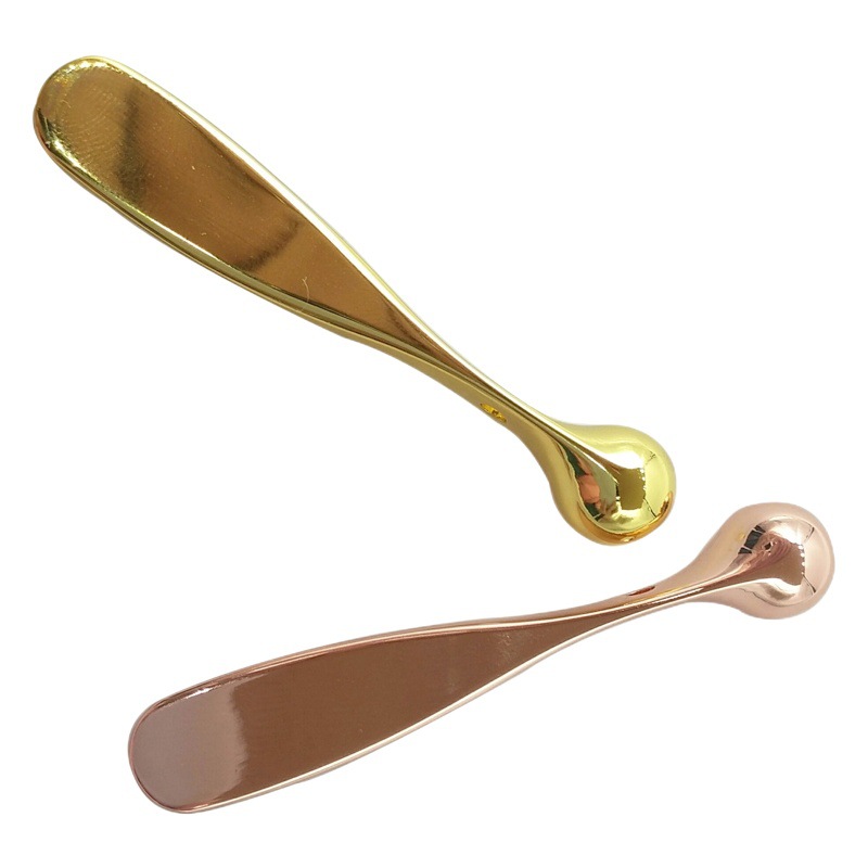 Stick masajeador metálico para crema de ojos, cuchara facial para masaje ocular y facial, herramienta de belleza de doble uso