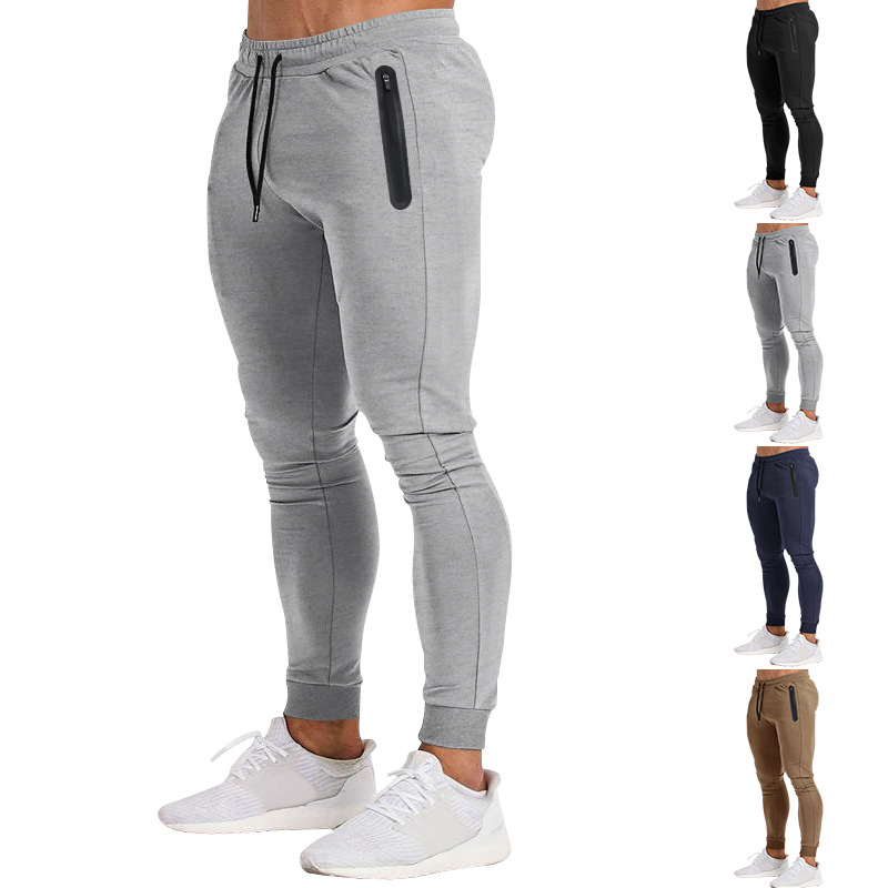 2023 Estación independiente transfronteriza europea y americana primavera y verano nueva versión ligera de color puro pantalones de fitness pantalones deportivos elásticos casuales moda masculina