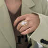 Retro fashionable design ring from pearl, French retro style, on index finger