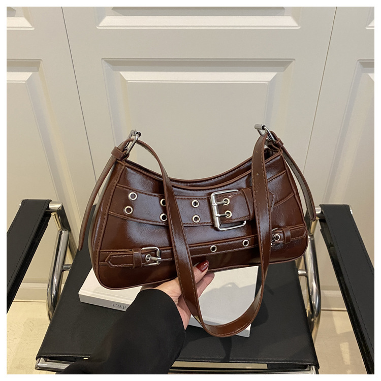 Transfronterizo 2025 primavera y verano nuevo estilo de alta calidad diseño de nicho bolso de viaje diario de un solo hombro bolso de axila con decoración de cinturón