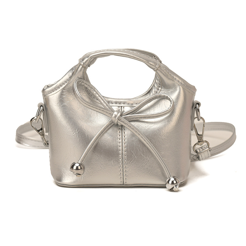 Bolsas infantiles transfronterizas de moda coreana de color sólido, bolsas de mano de chicas, mini bolsas de cestas de arco lindas